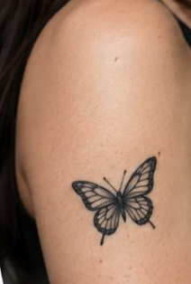 Original butterfly tattoo on an upper arm